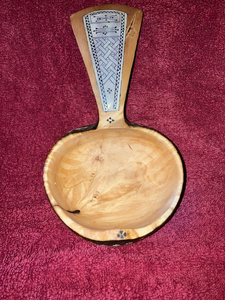 Hand-carved bowl with handle