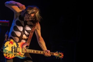 Photograph of Todd playing Fool Guitar