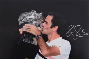 Photo: Roger with Trophy, signed by Roger Federer