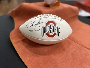 Autographed football by Urban Meyer